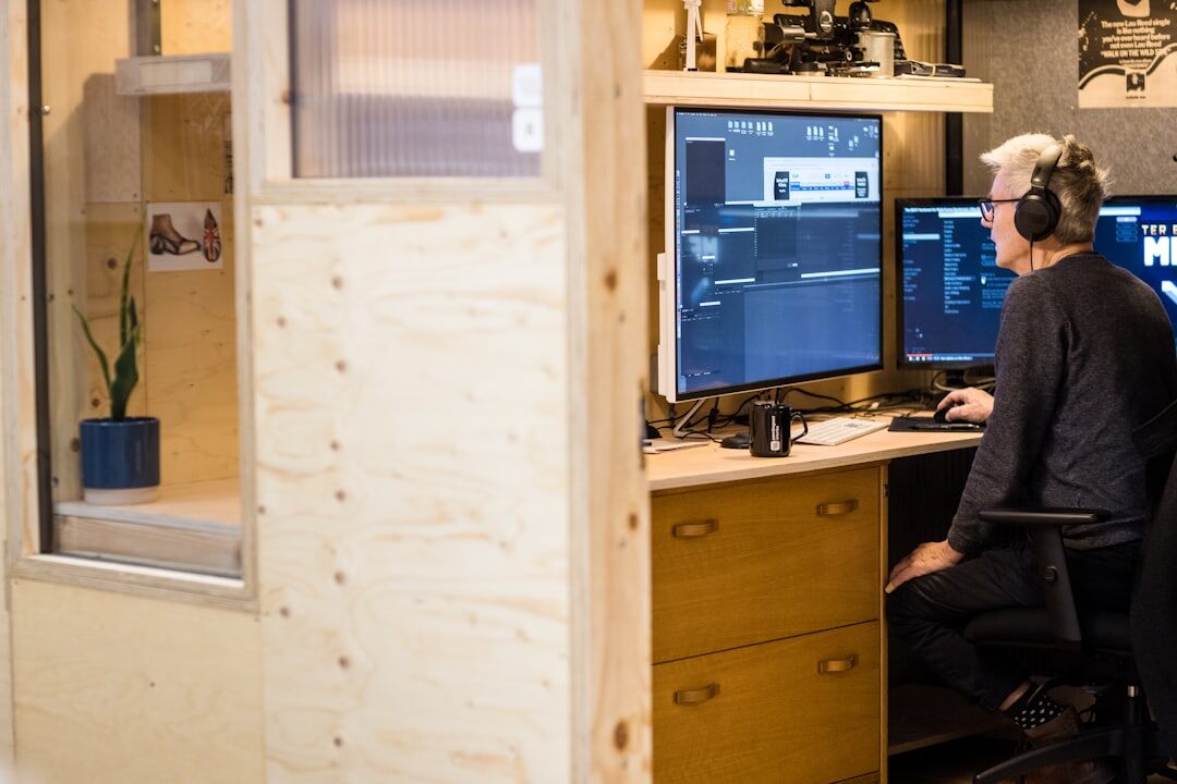 Editorial team reviewing archive footage on monitors in an office
