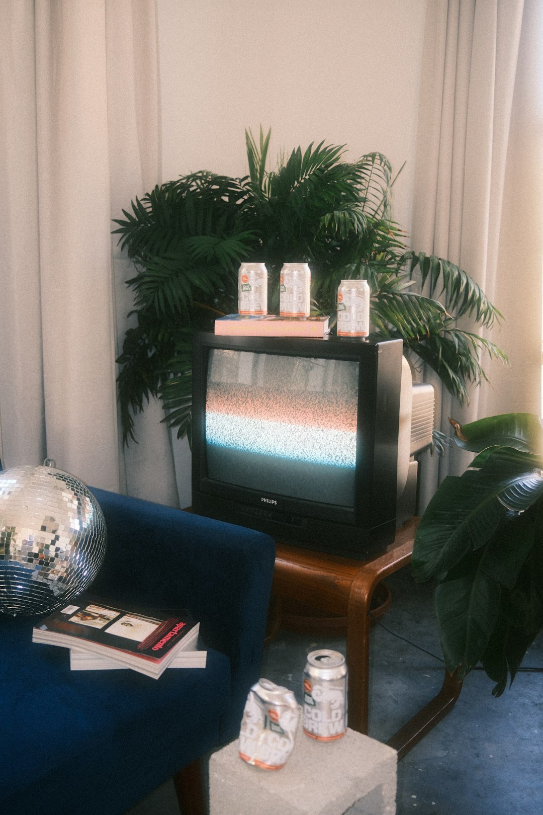 Vintage television set glowing in a cosy 1980s living room